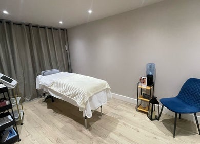 Haven Beauty Room in Hoddesdon, England, GB, featuring a cozy massage table and modern decor.