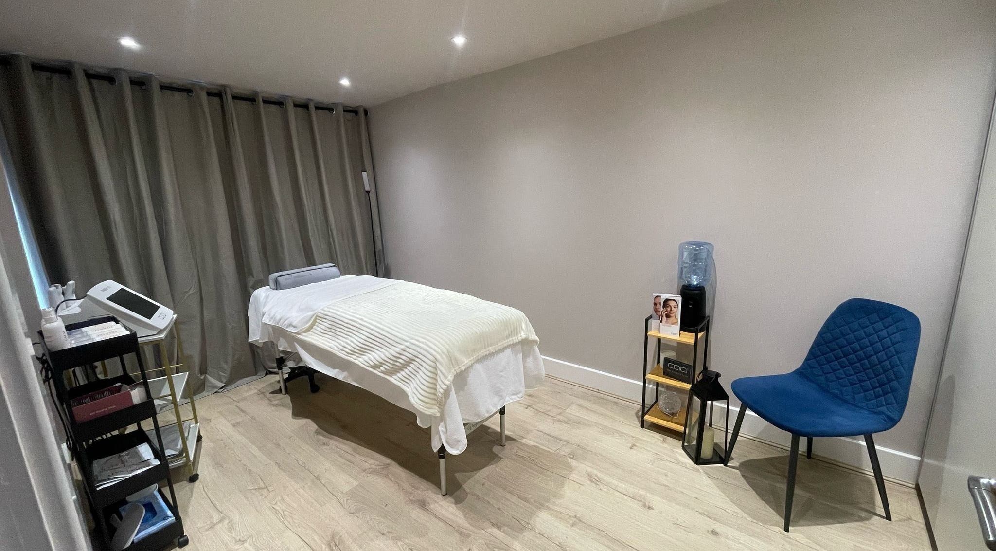 Haven Beauty Room in Hoddesdon, England, GB, featuring a cozy massage table and modern decor.