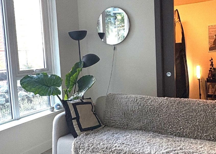 Inviting lounge area at Golden Sundays, Vancouver, British Columbia, CA, featuring a plush sofa and modern decor.