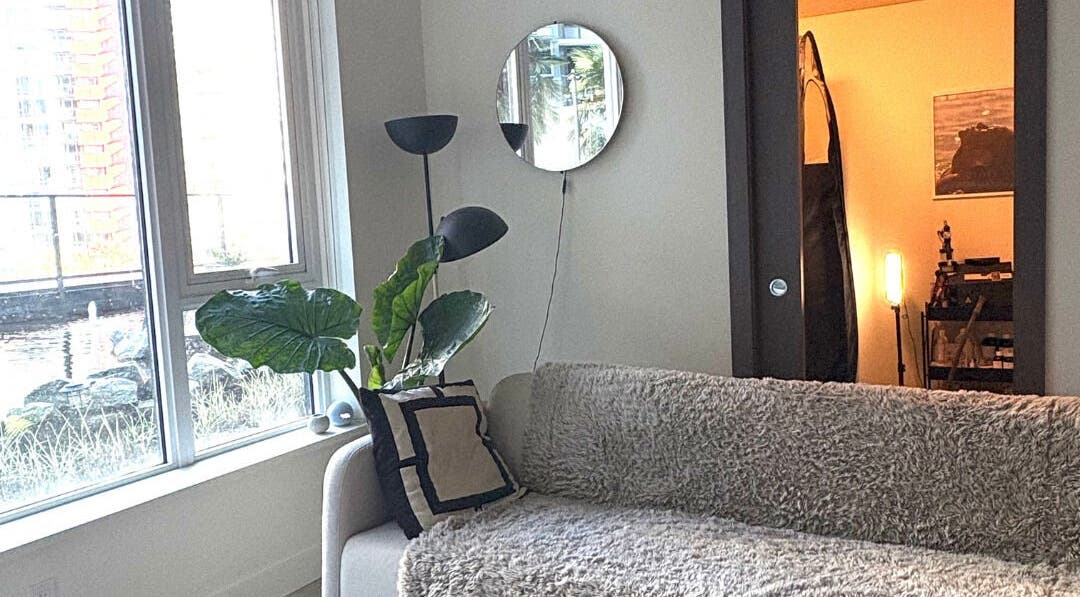 Inviting lounge area at Golden Sundays, Vancouver, British Columbia, CA, featuring a plush sofa and modern decor.