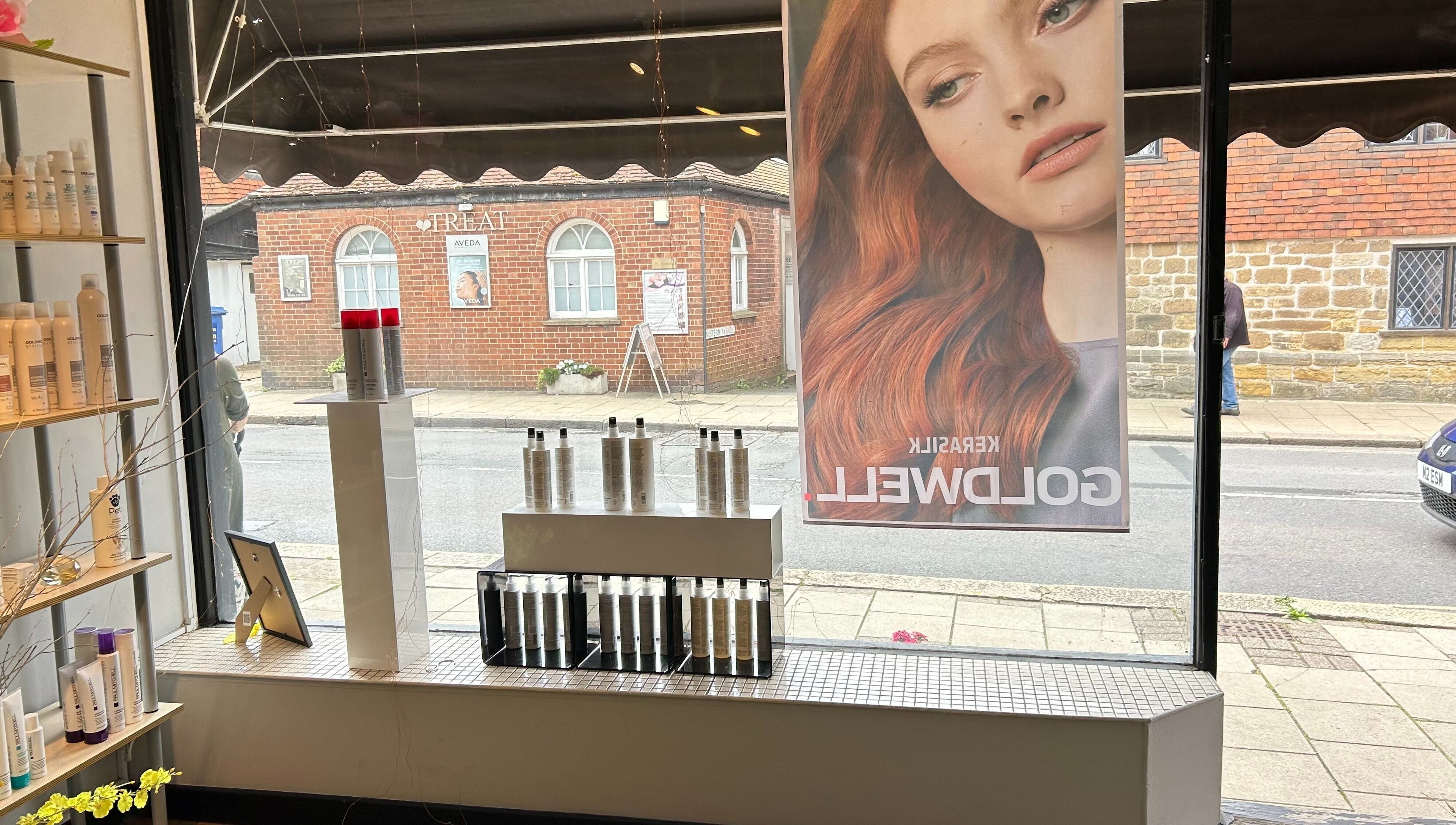 Interior window display at Panache Hair and Beauty Salon, Battle, England, GB featuring premium hair products.