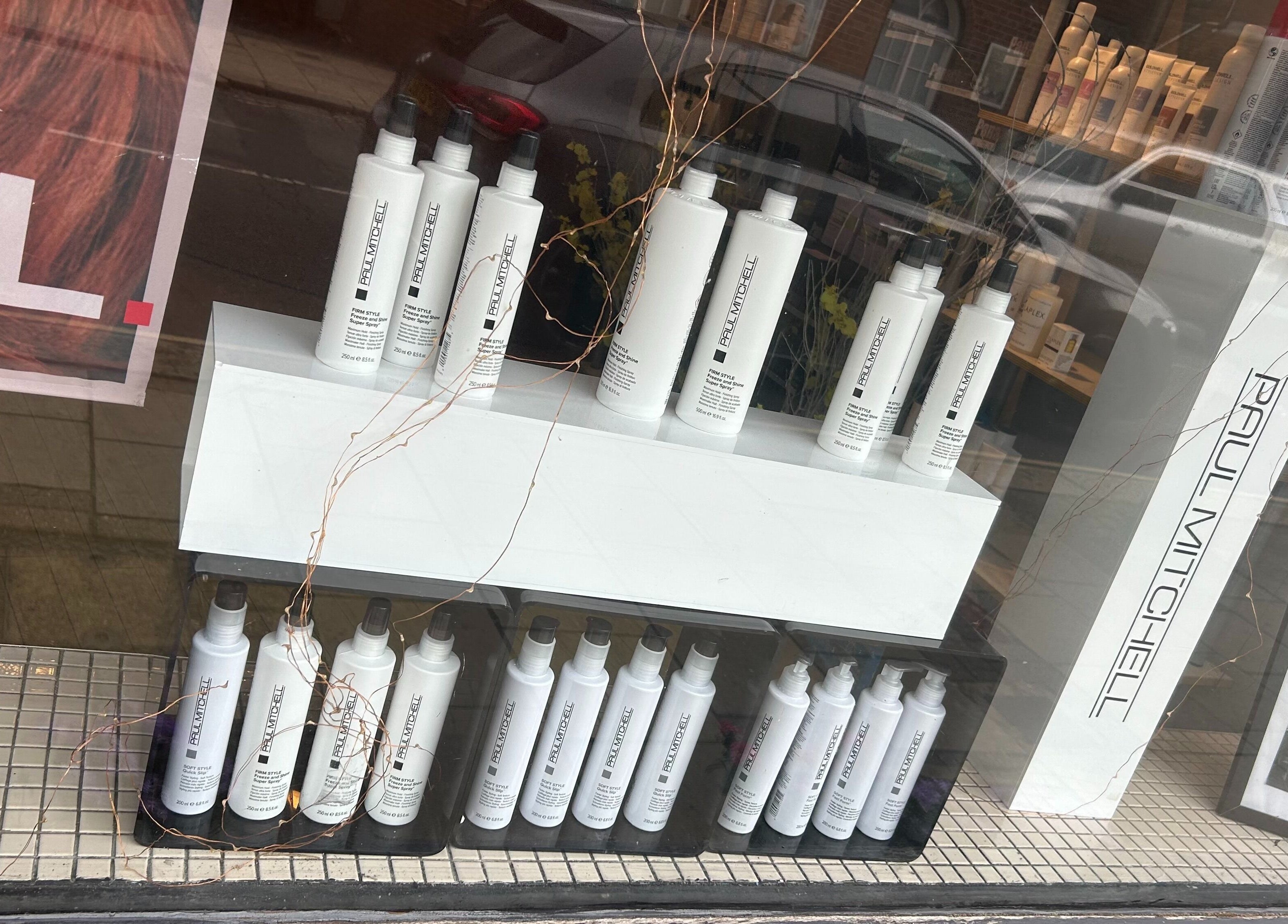 Panache Hair and Beauty Salon in Battle, England features Paul Mitchell products in its window display.