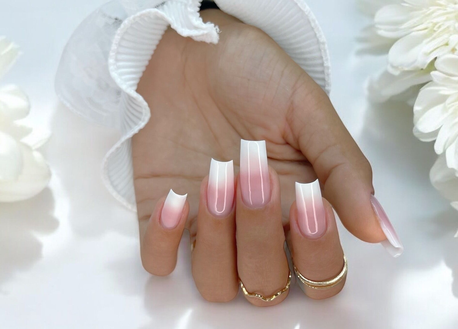 Elegant pink gradient nail art at Natalia Bernardes in Ilford, England, GB showcases stunning style and precision.