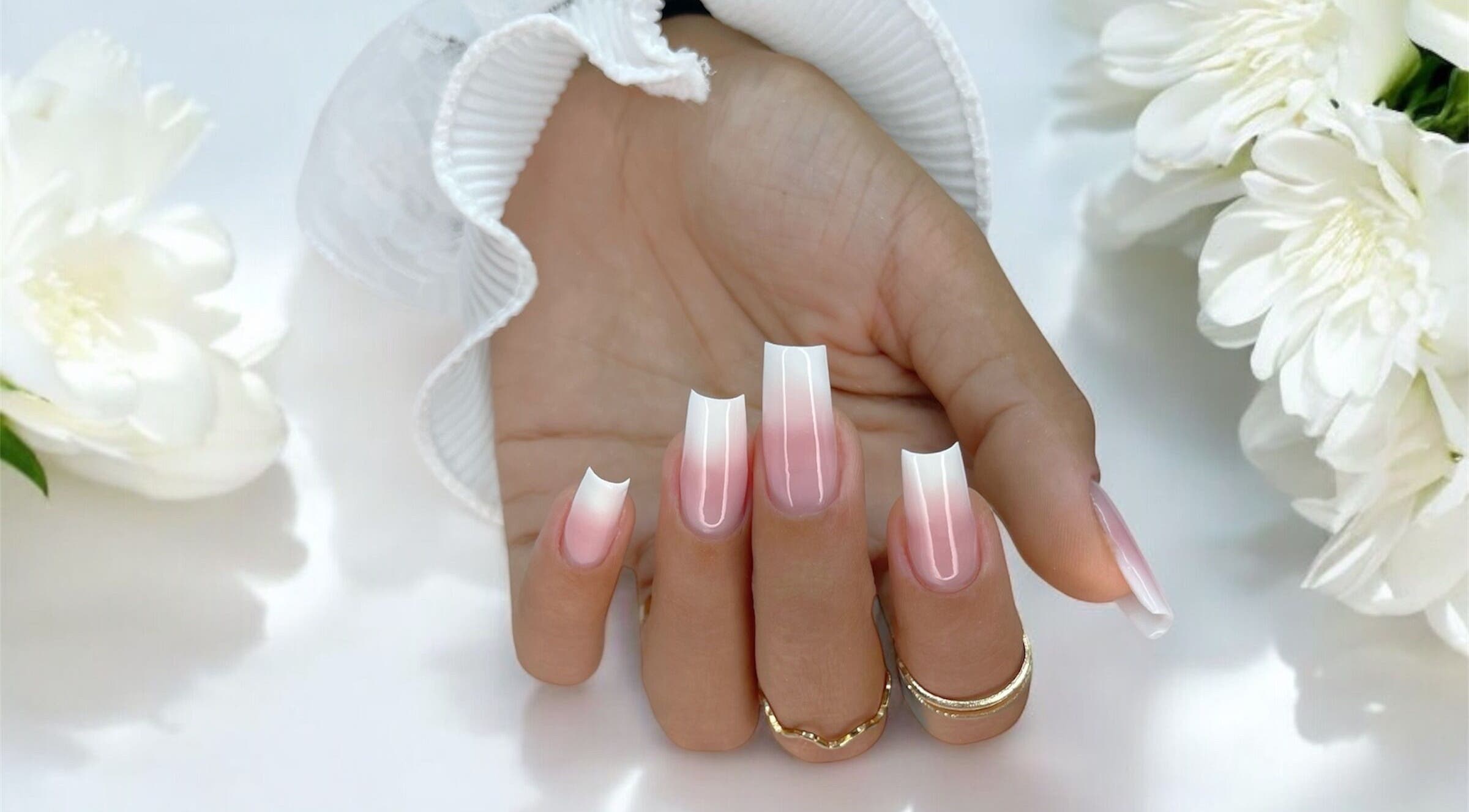 Elegant pink gradient nail art at Natalia Bernardes in Ilford, England, GB showcases stunning style and precision.
