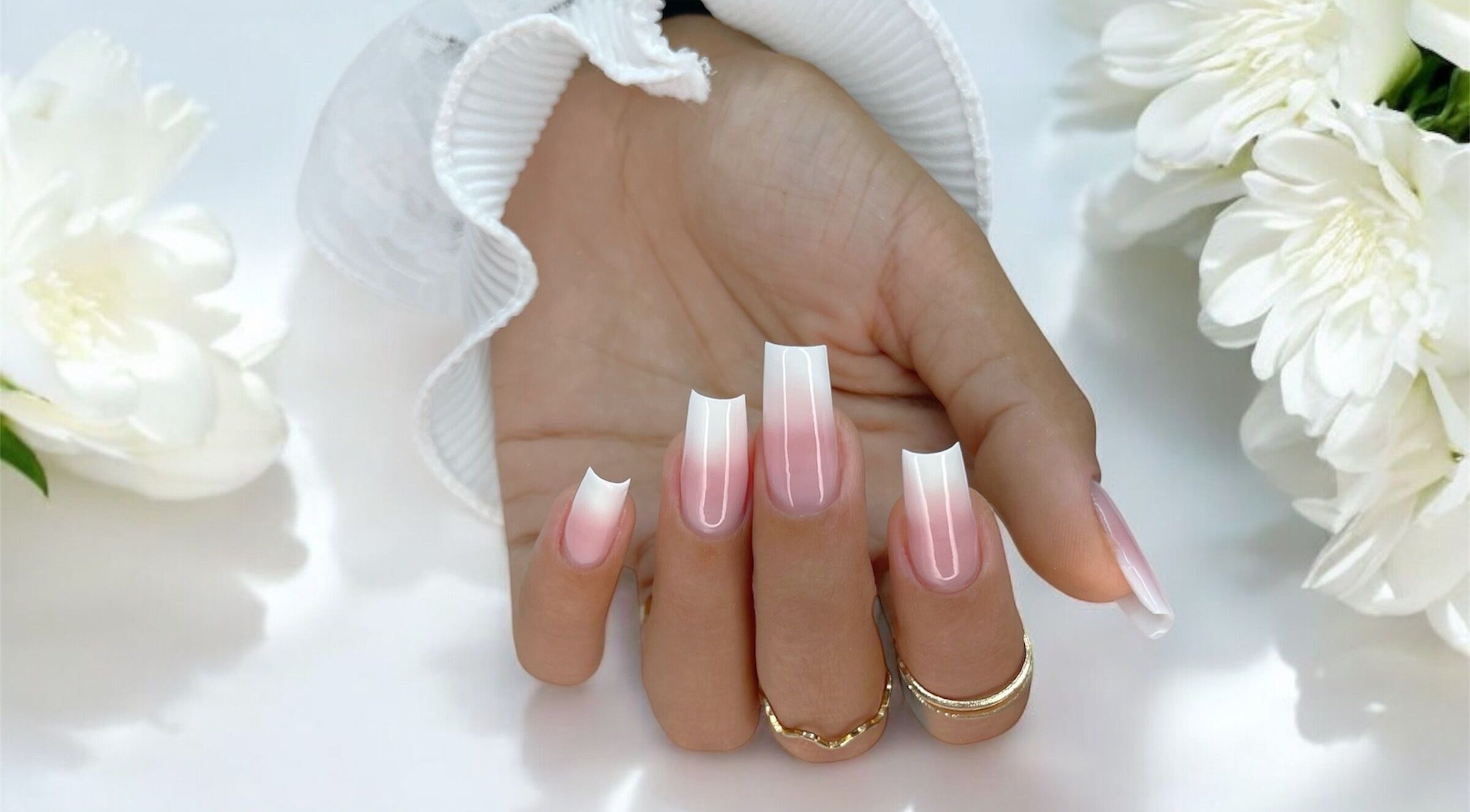 Elegant pink gradient nail art at Natalia Bernardes in Ilford, England, GB showcases stunning style and precision.