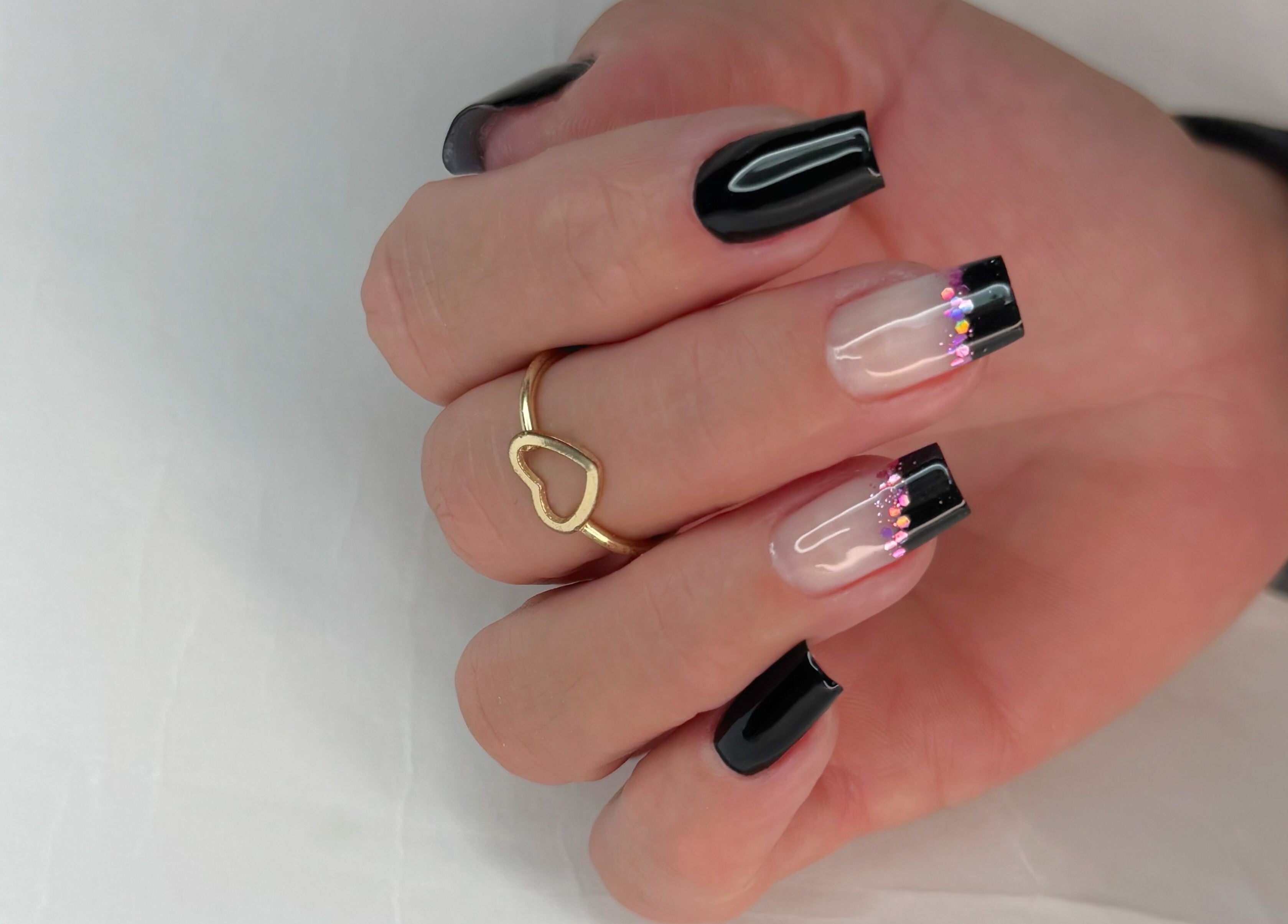 Stylish manicure with black tips at Natalia Bernardes, Ilford, England, GB.