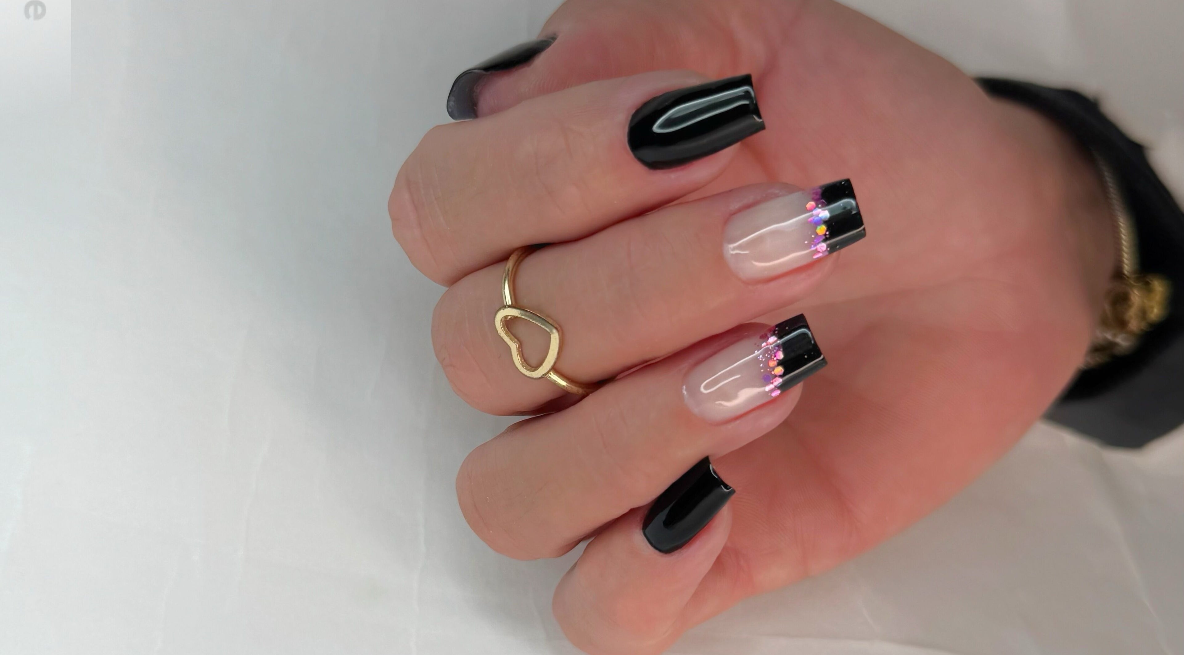 Stylish manicure with black tips at Natalia Bernardes, Ilford, England, GB.