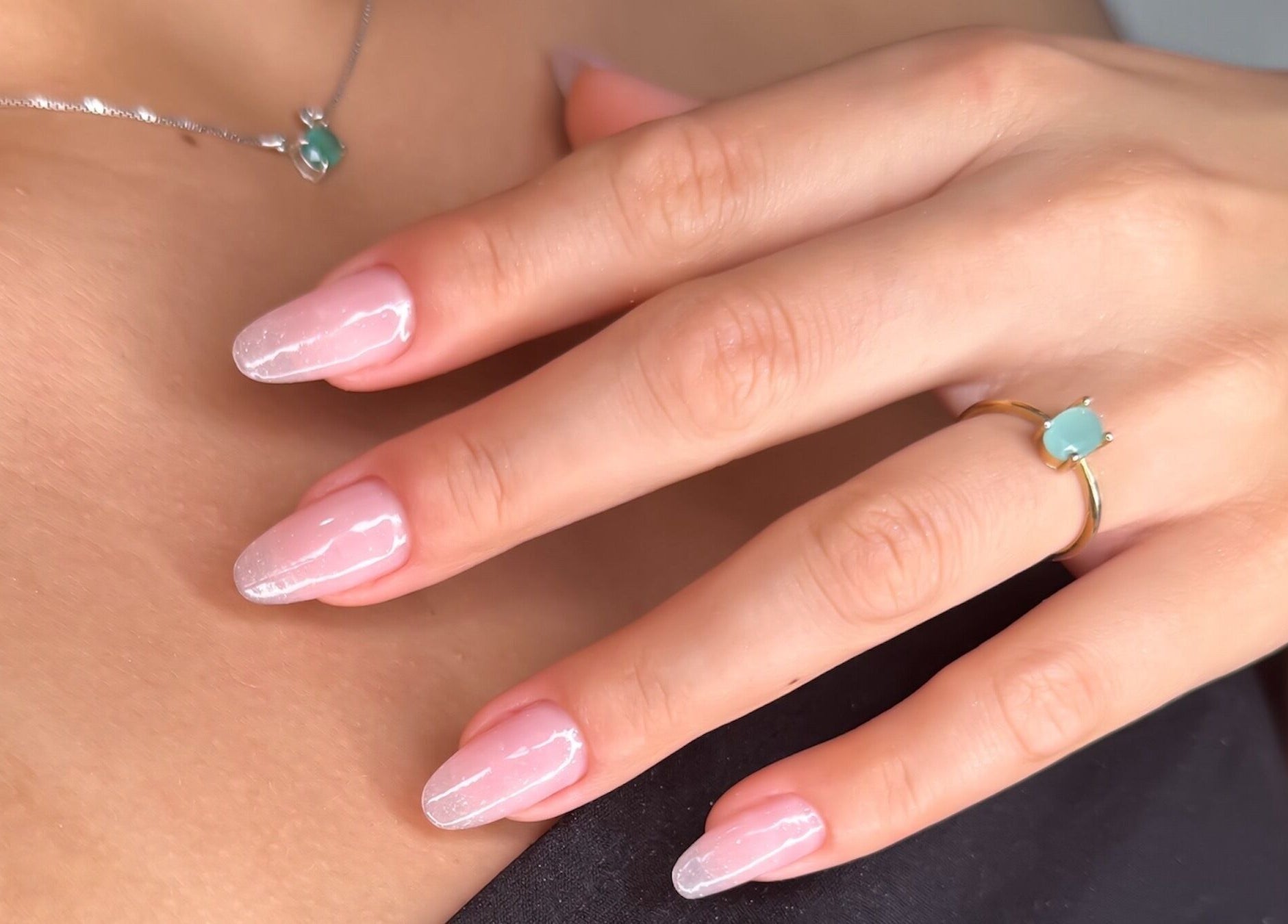 Close-up of elegantly manicured nails with jewelry at Natalia Bernardes, Ilford, England, GB.
