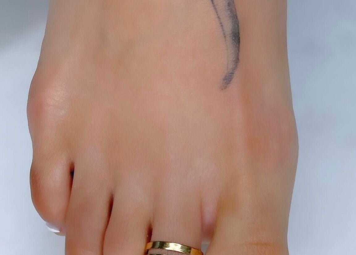 Close-up of a well-groomed foot with a small tattoo at Natalia Bernardes, Ilford, England, GB.