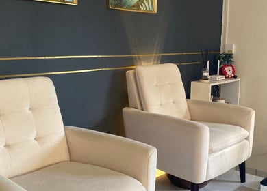 Elegant beige lounge chairs at Ana's Nails Studio, Paramaribo, Paramaribo, SR for a premium experience.