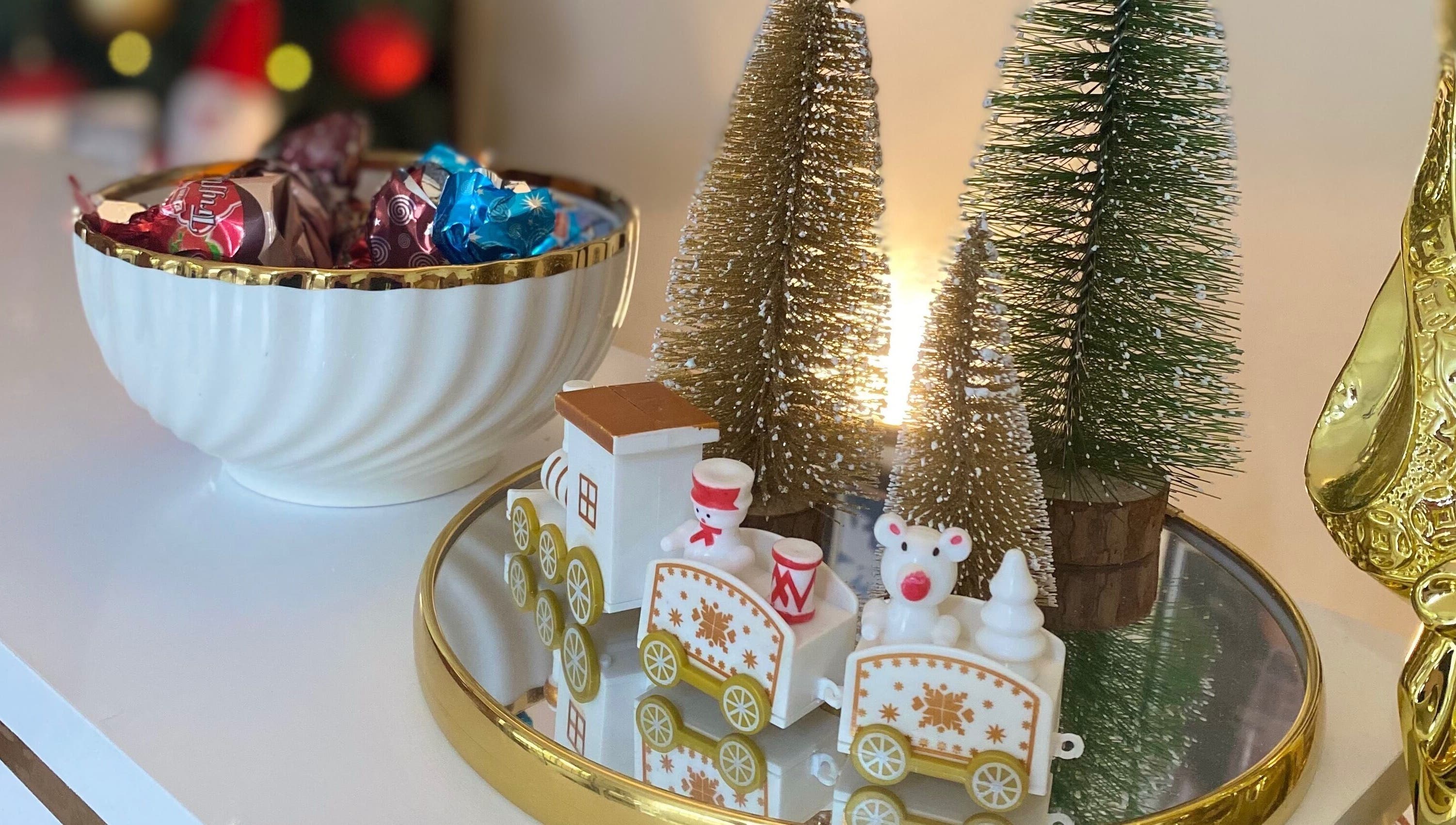 Festive holiday decor at Ana’s Nails Studio in Paramaribo, Paramaribo, SR with candy bowl and miniature train.
