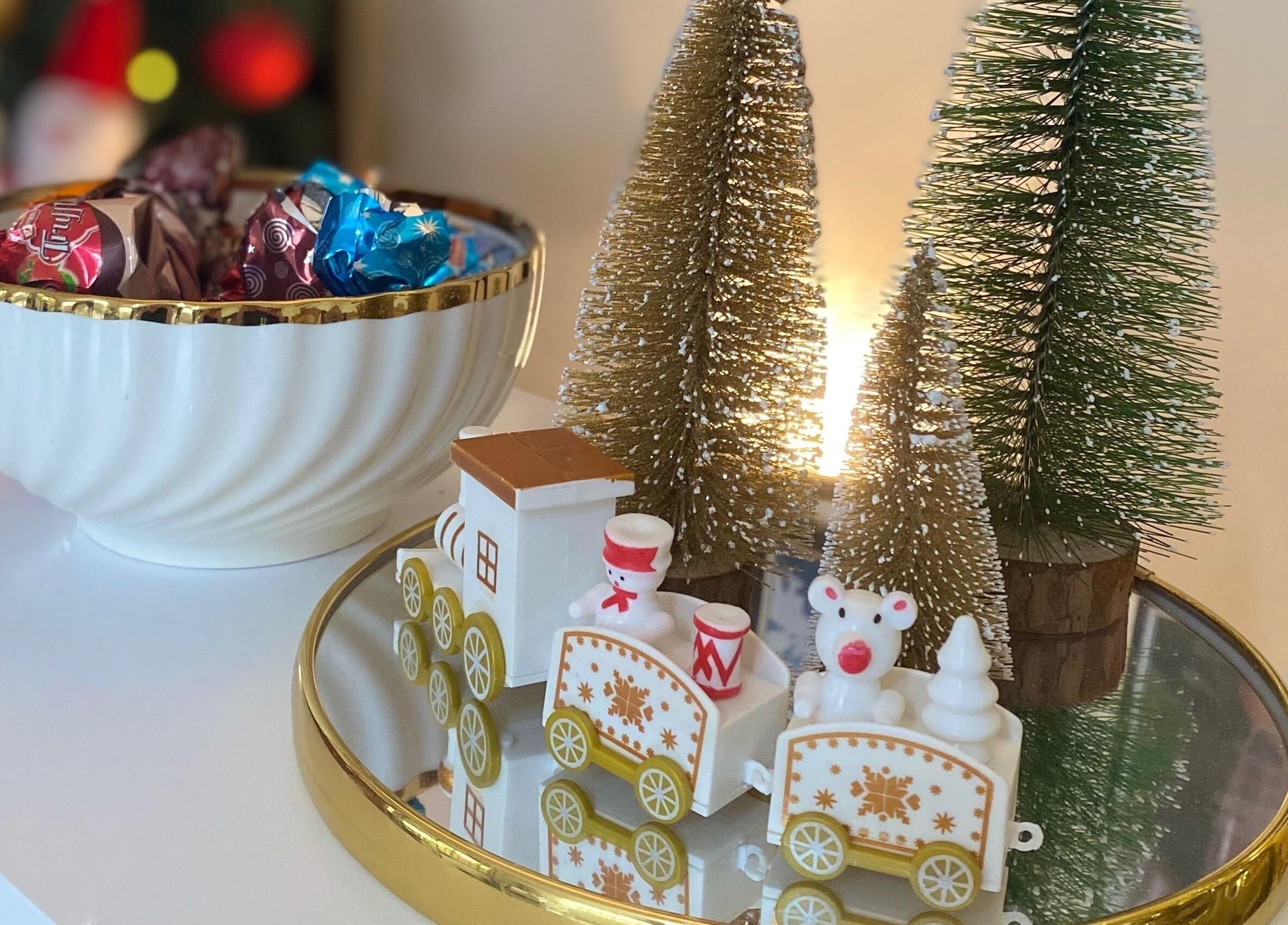 Festive holiday decor at Ana’s Nails Studio in Paramaribo, Paramaribo, SR with candy bowl and miniature train.