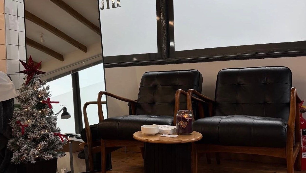 Elegant seating area at Luxe Lash by DK, Newcastle upon Tyne, England, GB, featuring stylish decor and leather chairs.