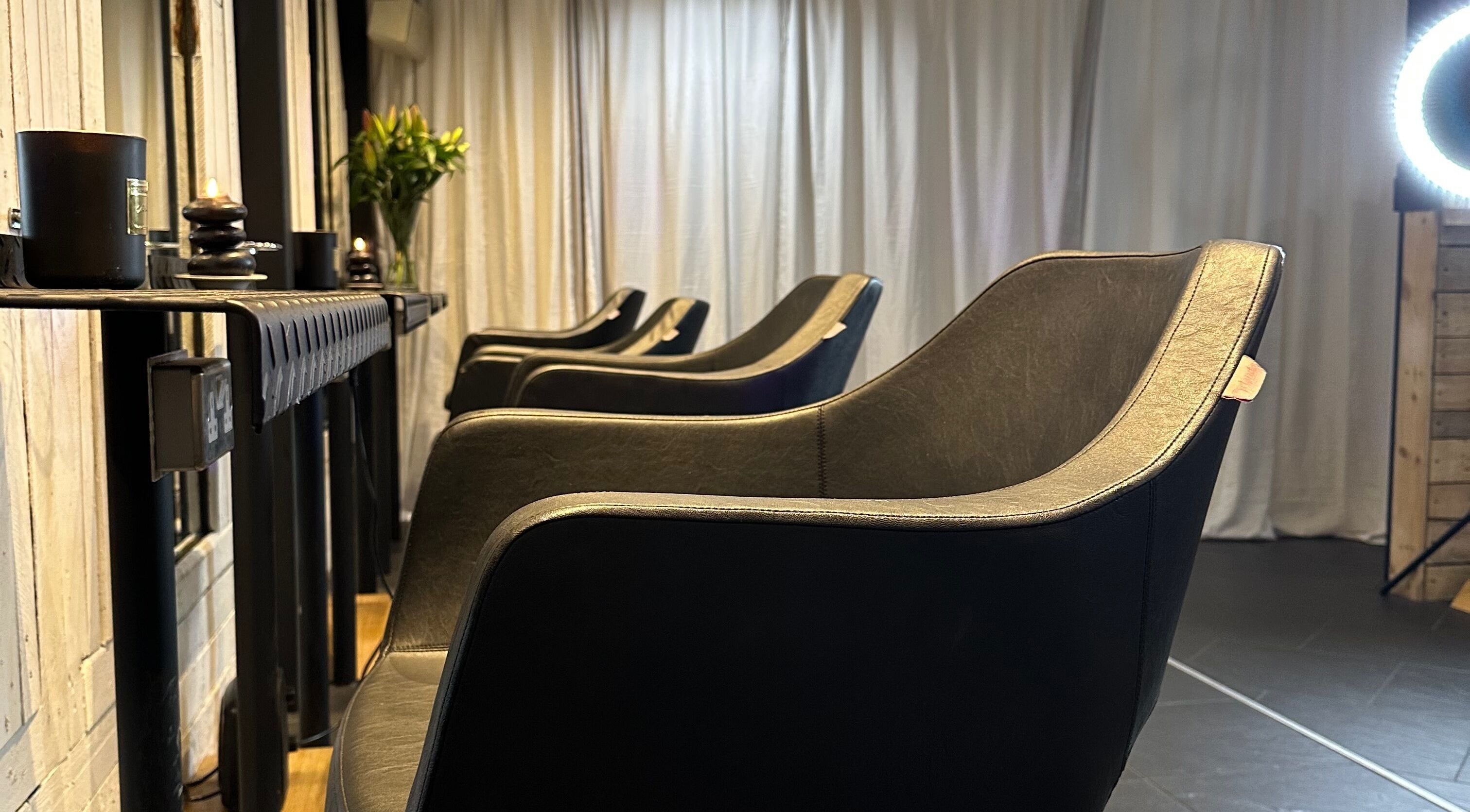 Stylish salon chairs at Kudos Forty Six, Torquay, England, GB, create a relaxed and luxurious atmosphere.