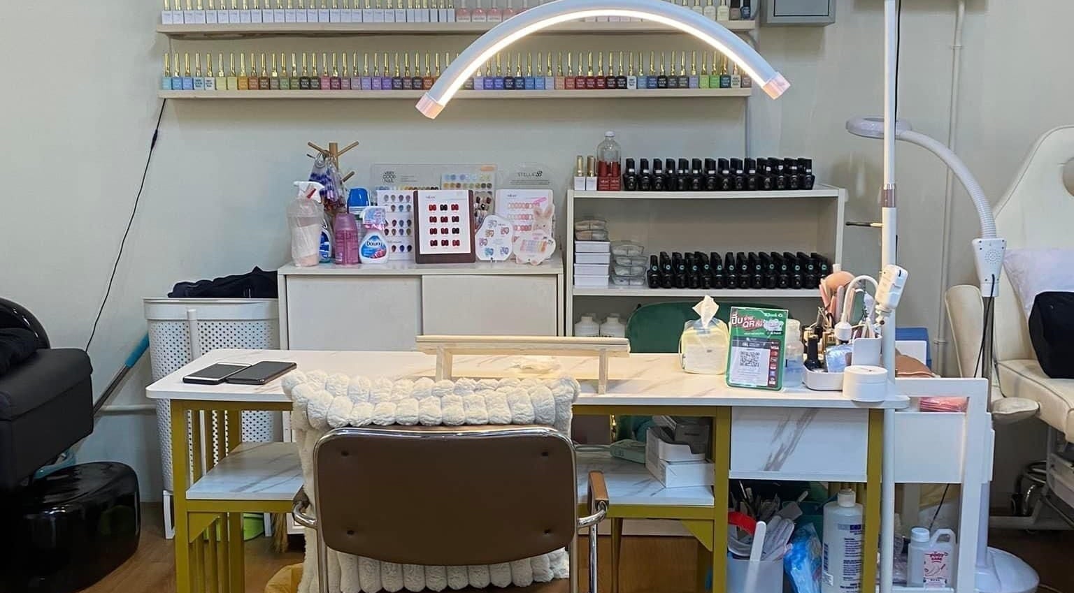 Manicure station at Bangkok Beauty Studio, Krung Thep Maha Nakhon, displaying nail polish colors.