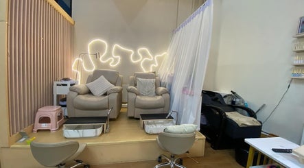 Relaxing pedicure chairs at Bangkok Beauty Studio in Krung Thep Maha Nakhon with ambient lighting.