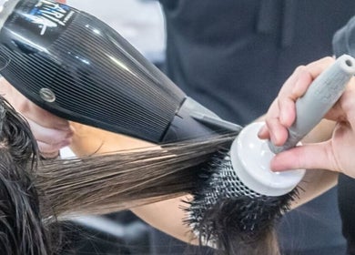Professional blow-dry at Christea Makeup Madonna, Wellington, Western Cape, ZA. Achieve sleek, styled hair effortlessly.