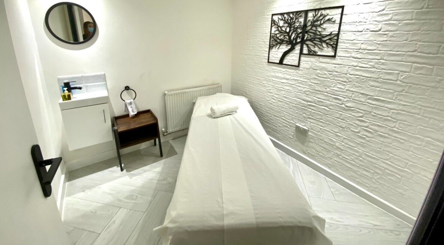 Private massage room at Thai Harmony Spa & Massage, London, England, GB, featuring a serene, minimalist design.