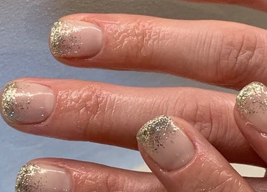 Elegant glitter manicure at Flair in Oldham, England, GB, showing stylish nail art.