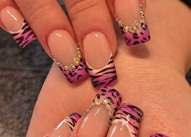 Stunning zebra-patterned nail art with rhinestones at J.m.nails, Fair Oak, England, GB.