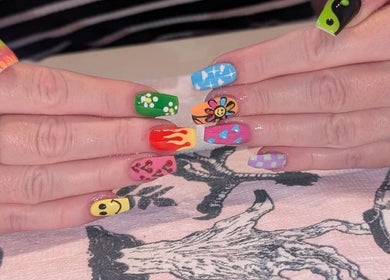 Vibrant nail art at J.m.nails in Fair Oak, England, GB showcasing colorful, intricate designs.