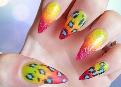 Colorful nail art design at J.m.nails in Fair Oak, England, GB, featuring a vivid gradient and artistic patterns.