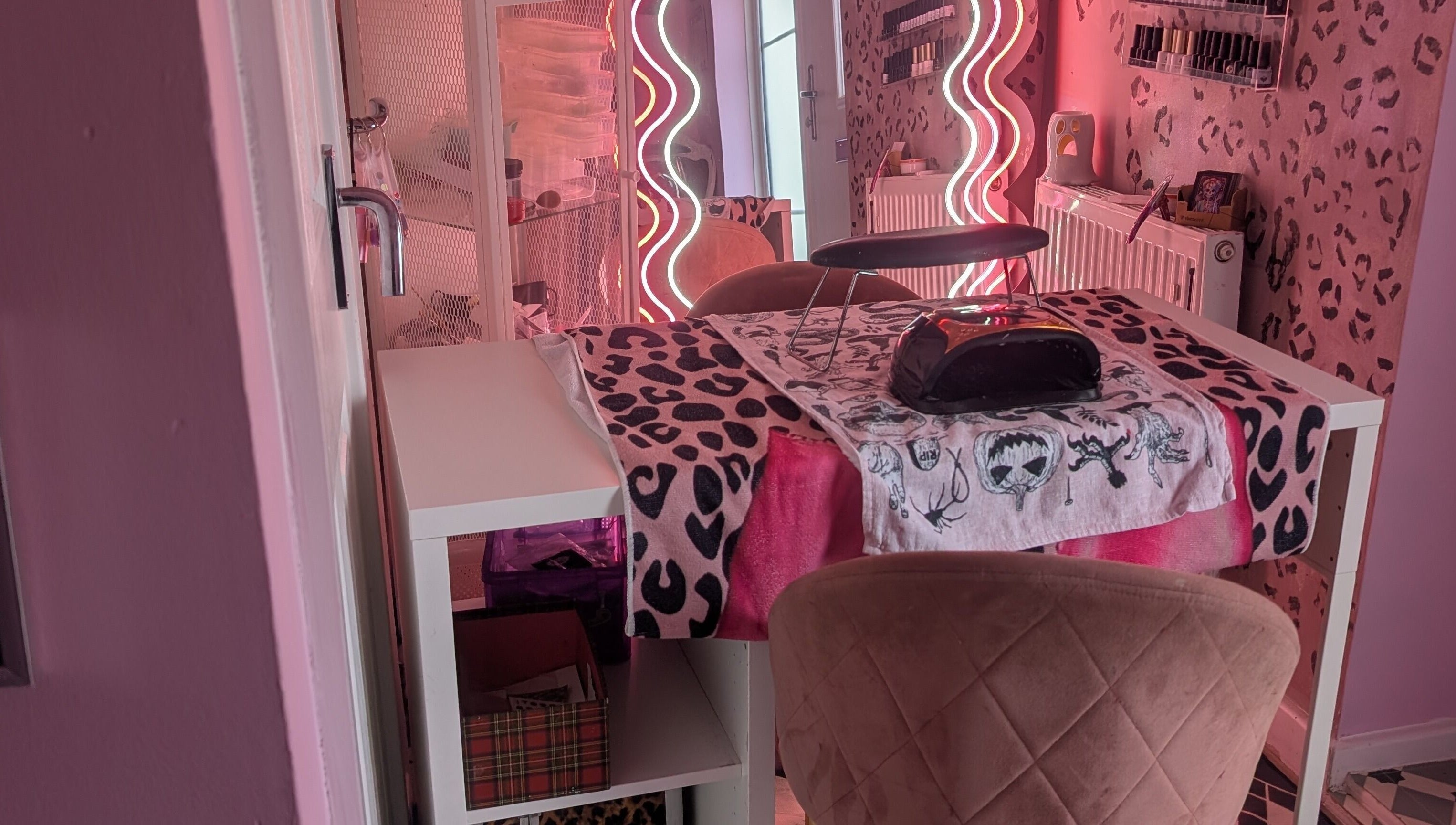 Chic nail station with leopard print decor at J.m.nails, Fair Oak, England, GB. Vibrant and stylish ambiance.