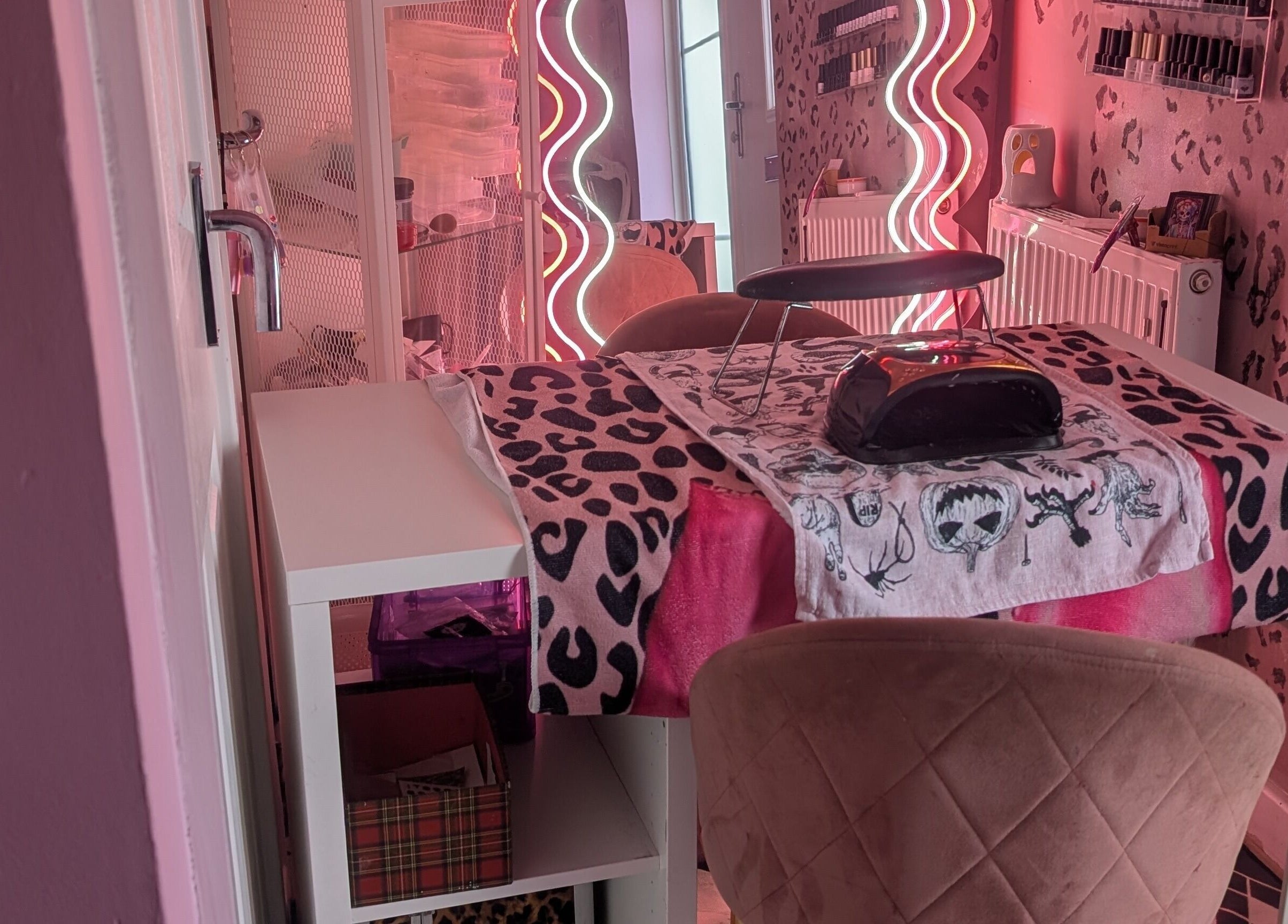 Chic nail station with leopard print decor at J.m.nails, Fair Oak, England, GB. Vibrant and stylish ambiance.