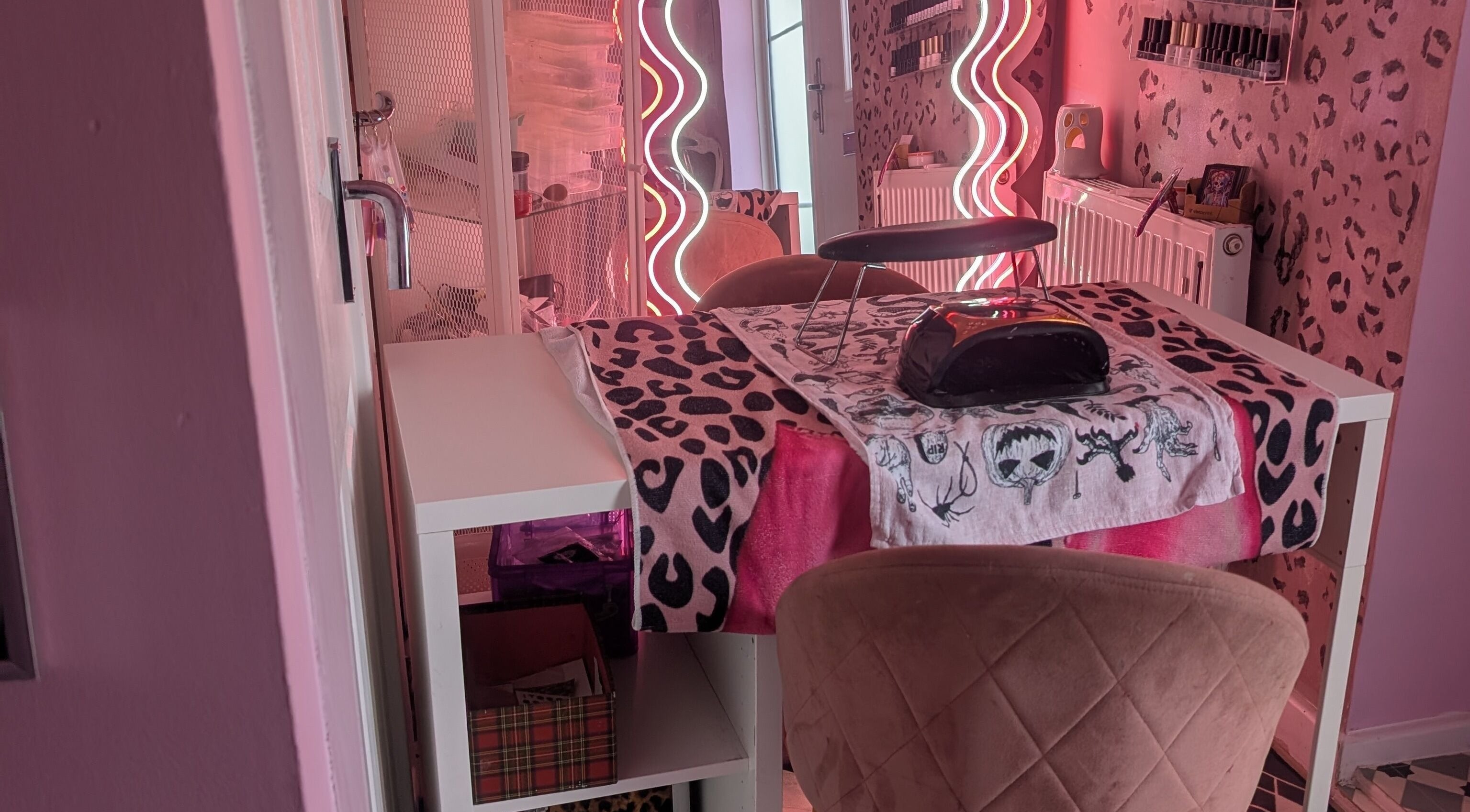 Chic nail station with leopard print decor at J.m.nails, Fair Oak, England, GB. Vibrant and stylish ambiance.