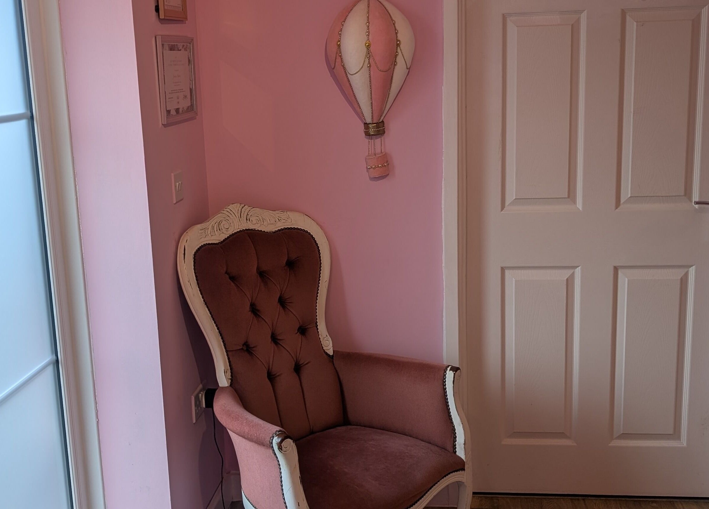 Chic pink armchair in J.m.nails, Fair Oak, England, GB offers relaxing ambiance.