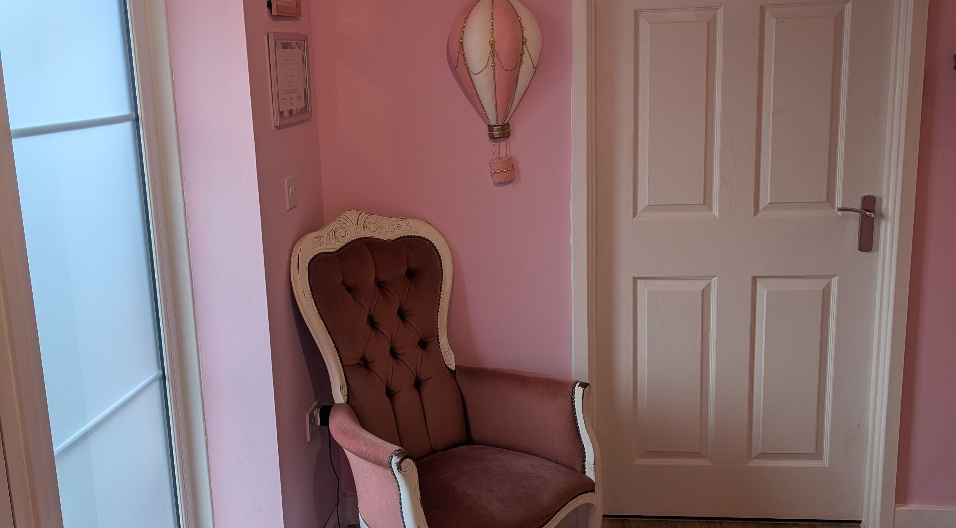 Chic pink armchair in J.m.nails, Fair Oak, England, GB offers relaxing ambiance.