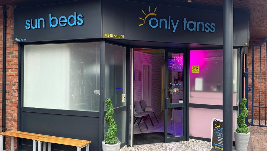 Front view of Only Tans salon in Wickford, England, GB with bright signage and open entrance.