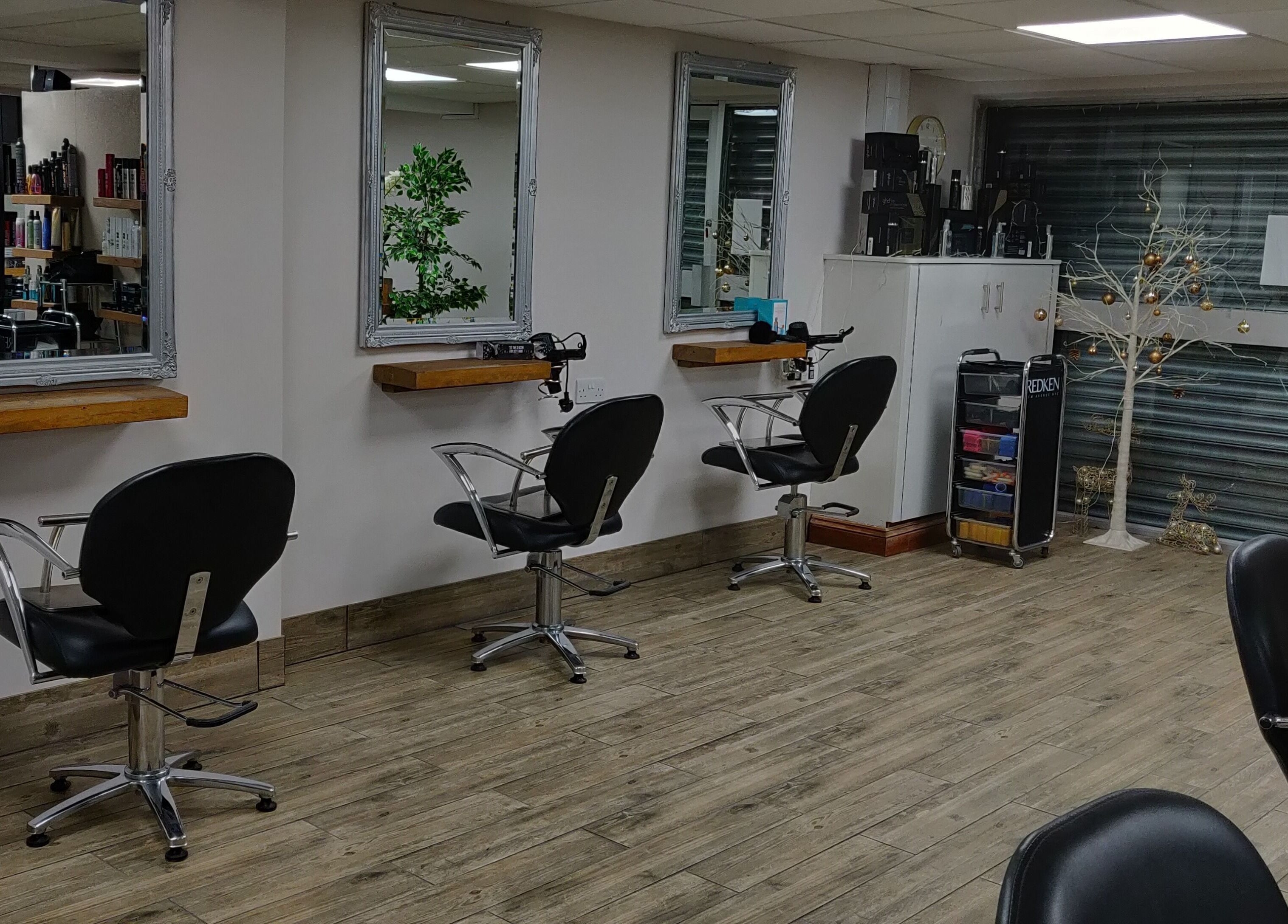 Modern styling stations at Mane Creations in Colchester, England, GB, showcasing professional salon setup.