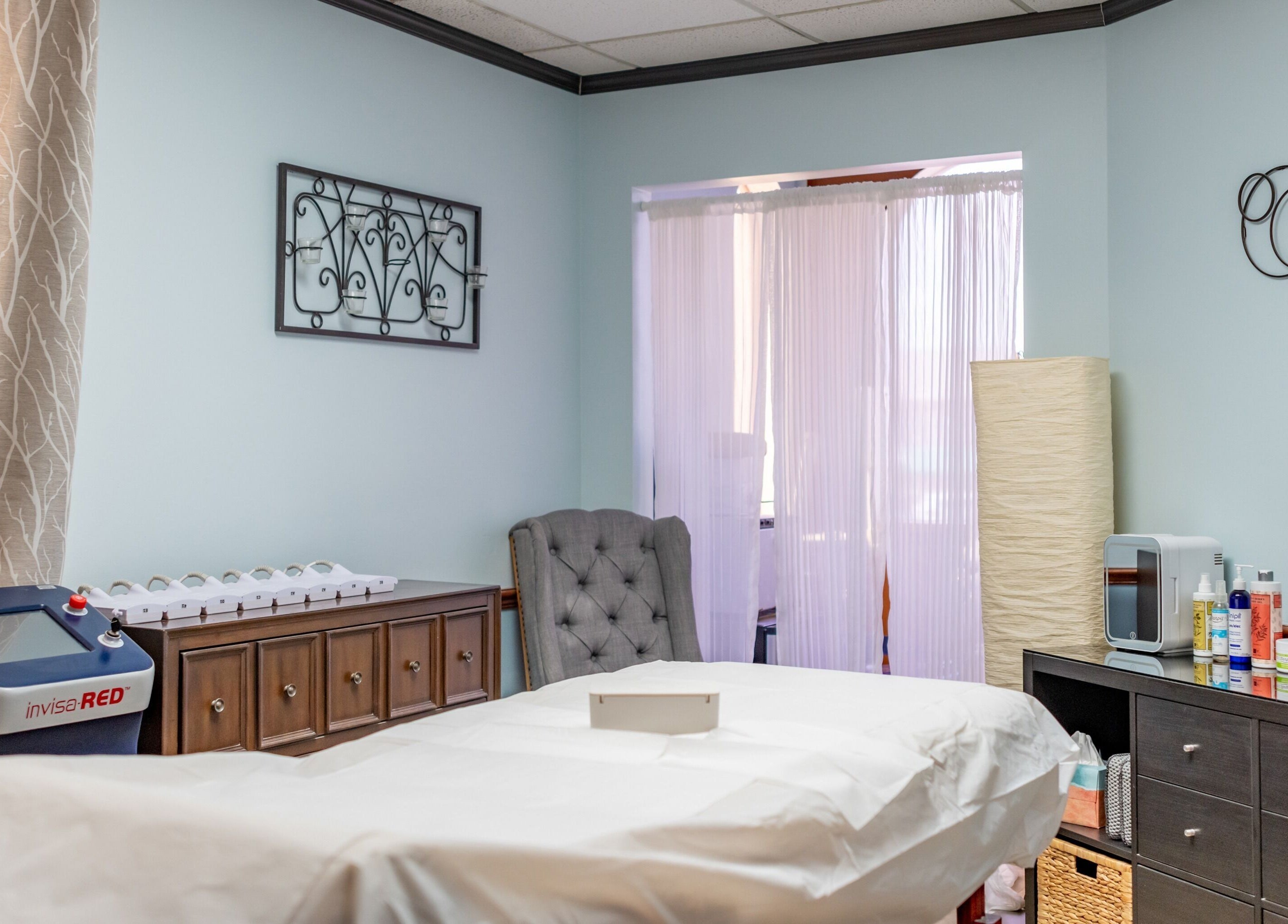 Calming spa room at Absolute Body Waxing and Spa in Winter Park, Florida, US, featuring a treatment bed.
