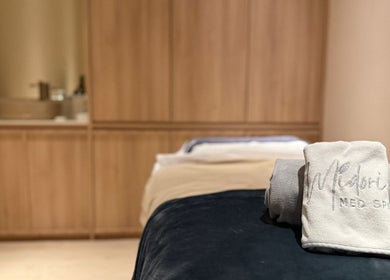 Cozy treatment room at Midori Med Spa with plush towels, Singapore, Singapore, SG.