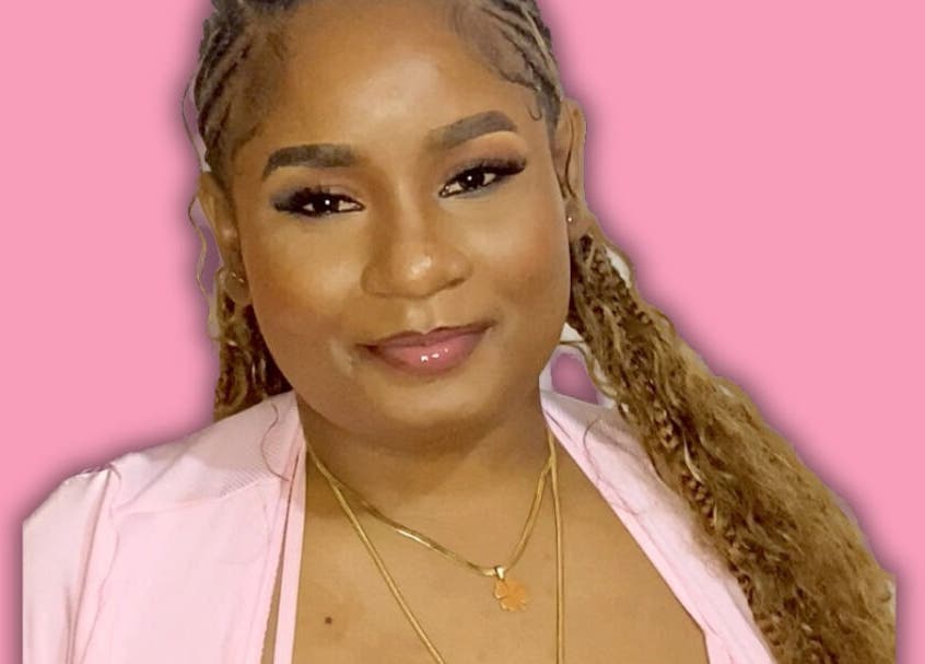 Person smiling at Dime Divine Looks, Kingston, St. Andrew Parish, JM. Embracing beauty and wellness.