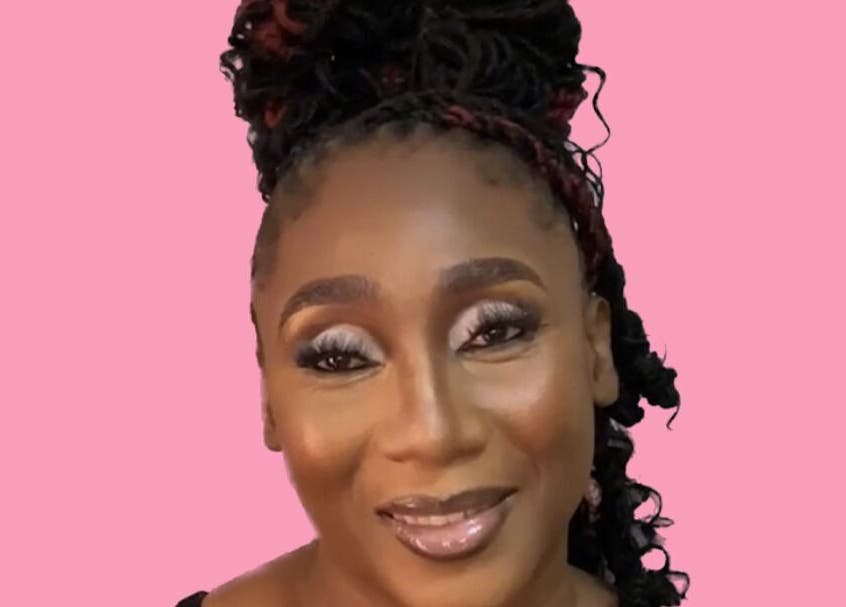 Woman with elegant makeup at Dime Divine Looks, Kingston, St. Andrew Parish, JM, showcasing beauty service.