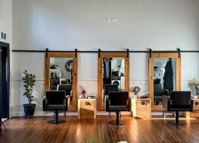 Modern salon interior at Colestè Twilley Makeup, Crows Nest, Queensland, AU with chic styling chairs and mirrors.