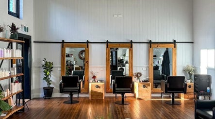 Modern salon interior at Colestè Twilley Makeup, Crows Nest, Queensland, AU with chic styling chairs and mirrors.