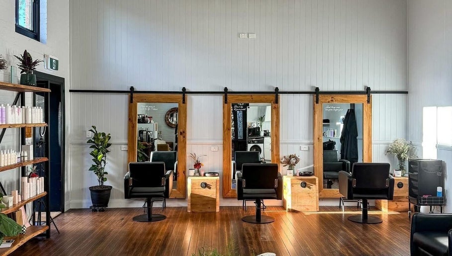 Elegant salon interior at Colestè Twilley Makeup, Crows Nest, Queensland, AU featuring chairs and mirrors.