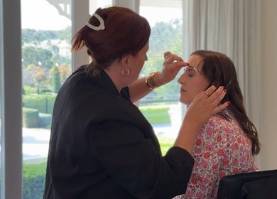 Makeup artist at Colestè Twilley Makeup in Crows Nest, Queensland, AU perfecting a client's look.