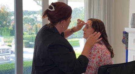 Makeup artist at Colestè Twilley Makeup in Crows Nest, Queensland, AU perfecting a client's look.