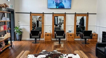 Stylish salon at Colestè Twilley Makeup, Crows Nest, Queensland, AU with wood decor and modern chairs.