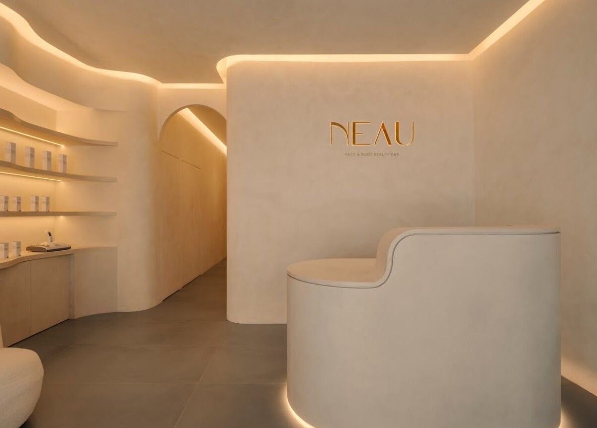 Modern interior of NEAU in Singapore, Singapore, SG with curved walls and ambient lighting.