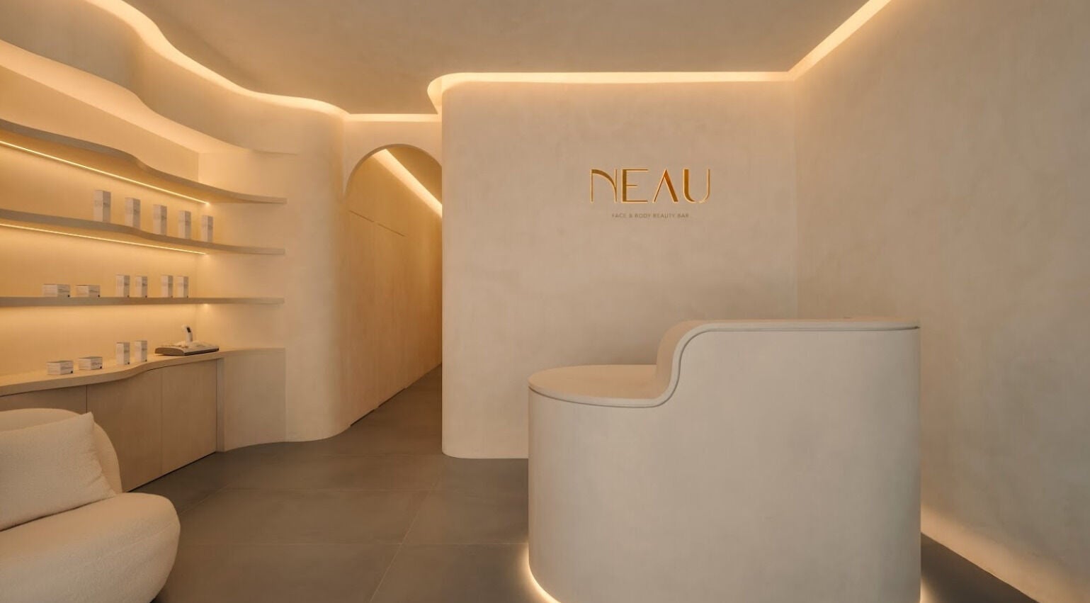 Modern interior of NEAU in Singapore, Singapore, SG with curved walls and ambient lighting.