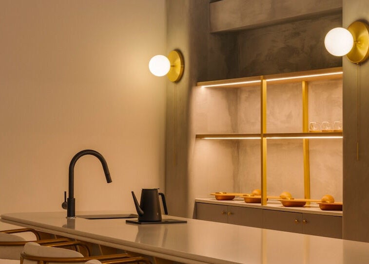 NEAU's chic lounge area in Singapore, SG with modern lighting and seating.