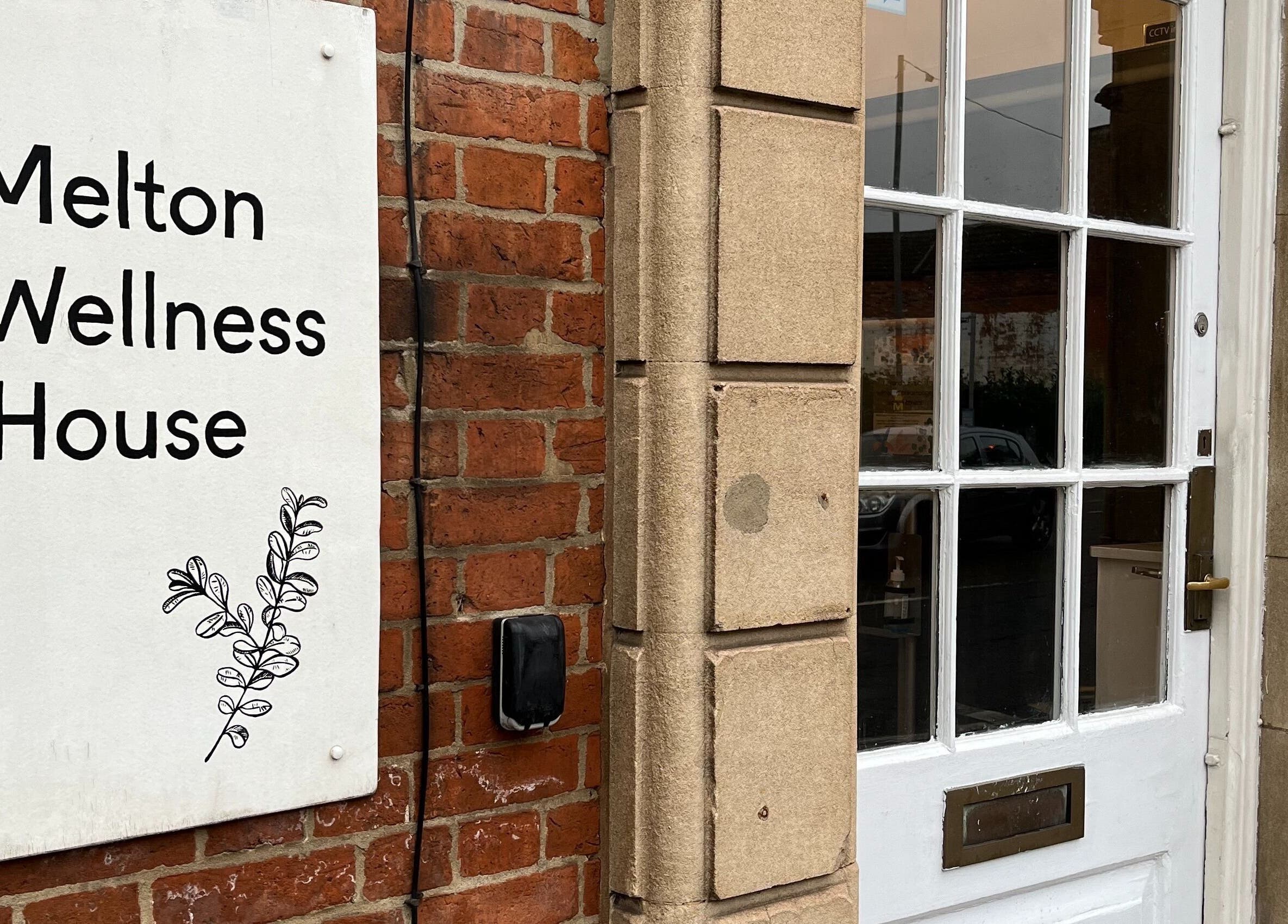 Front view of Melton Wellness House sign at Hummingbird Hideaway, Melton Mowbray, England, GB.