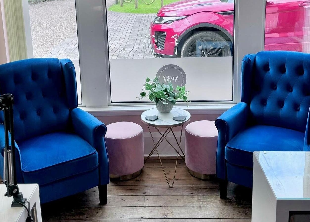 Blue velvet chairs and pink stools at No37 Home of Beauty and Aesthetics, Kirkby in Ashfield, England, GB.