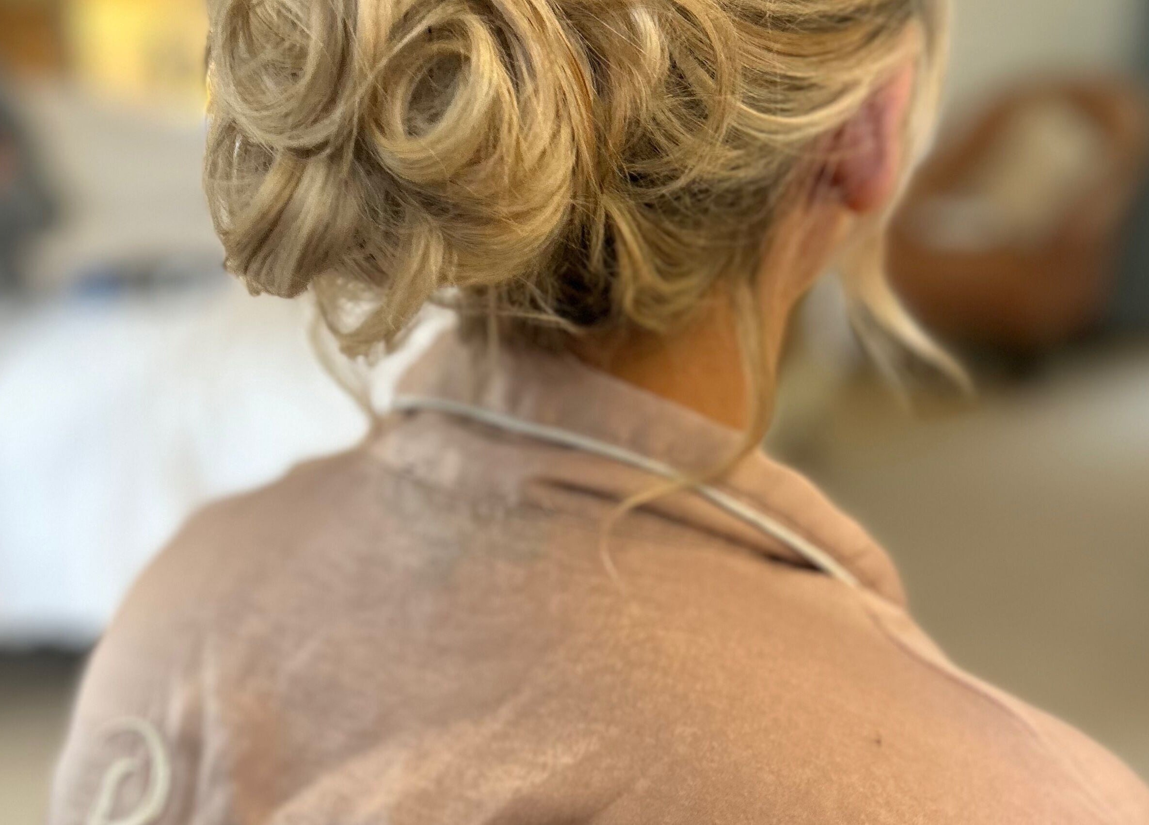 Sophisticated bridal updo hairstyle at Navy in Halesworth, England, GB.