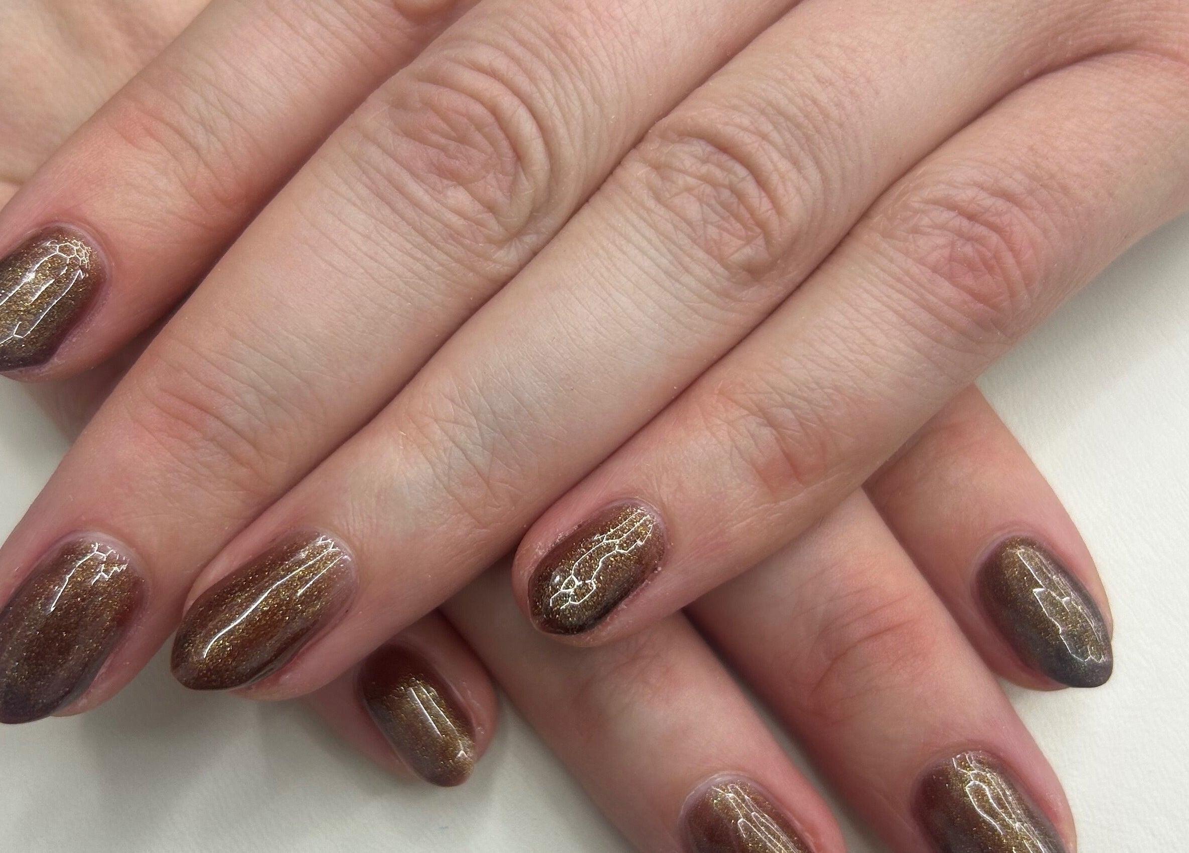 Perfectly manicured nails with shimmering polish at Navy, Halesworth, England, GB.